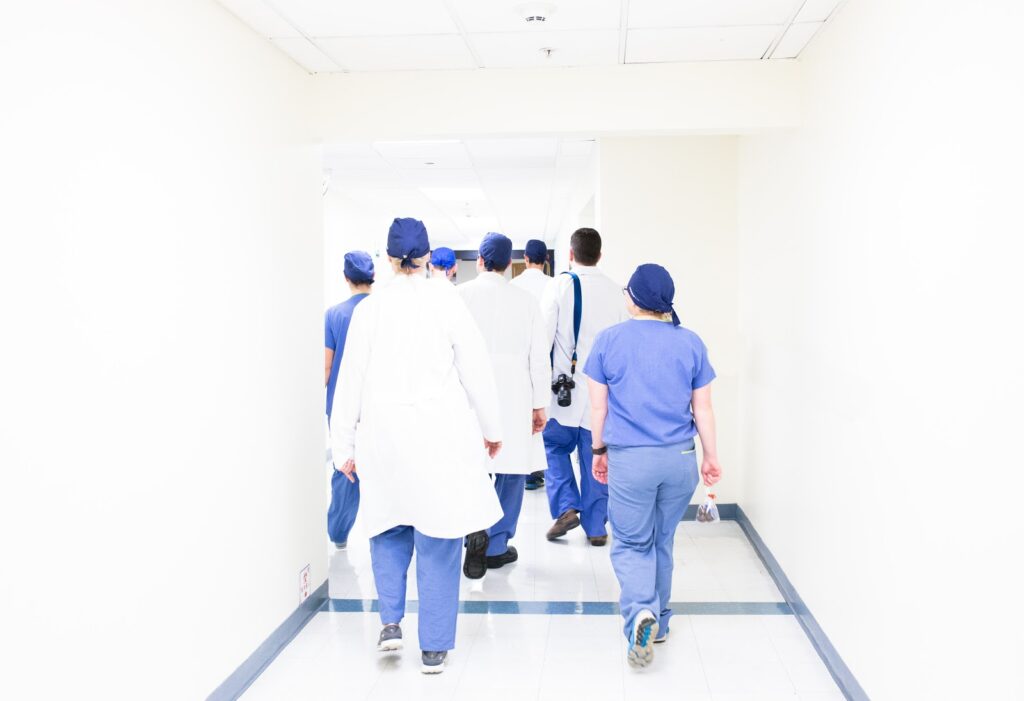 doctors walking down hallway hospital exposure control plan