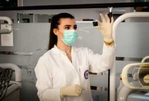 woman in gloves and mask biohazard hospital covid-19