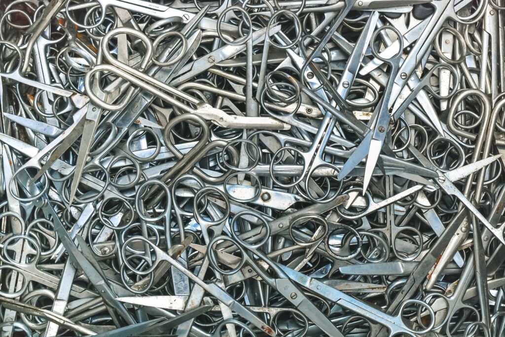 A pile of  surgical scissors
